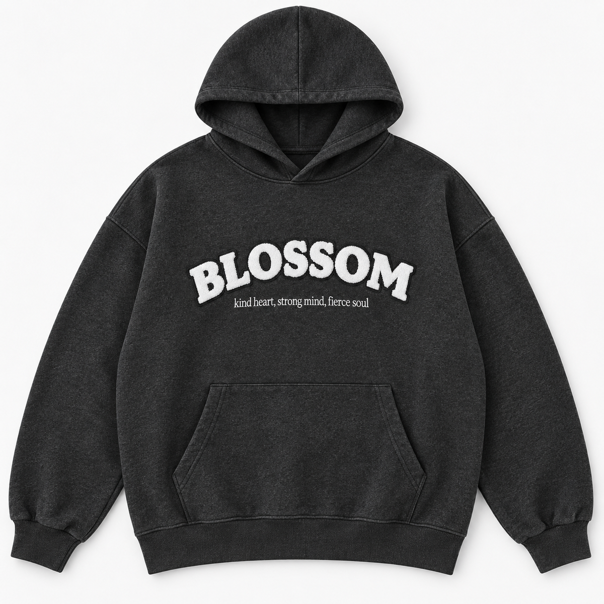 A dark charcoal gray hooded sweatshirt with a white graphic text print reading 'BLOSSOM' and a smaller tagline underneath reading kind heart, strong mind, fierce soul, displayed on a clean white background.
