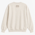 A cream-colored crewneck sweatshirt shown from the back, featuring the text 'kind heart strong mind fierce soul' printed in a small brown font on the upper back.