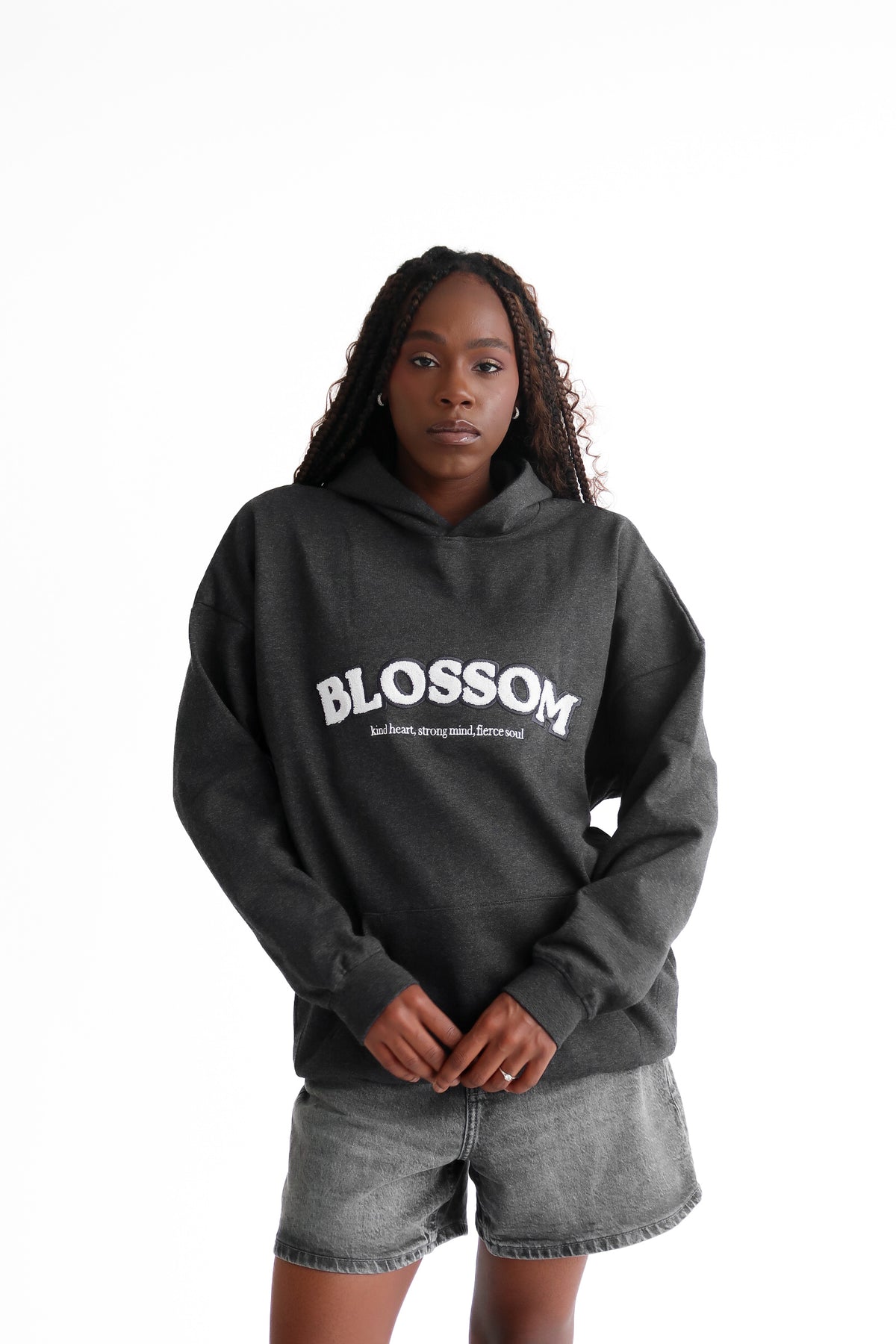 Grey blossom hoodie. Recycled hoodie, black model, oversized hoodie, empowering brand.