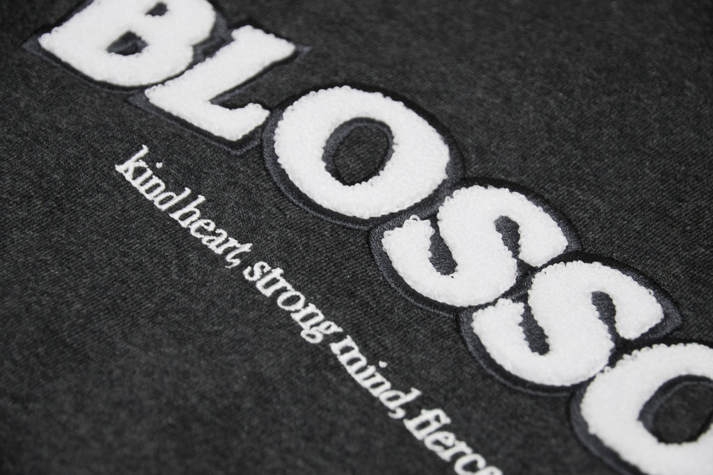 Details close up of charcoal hoodie blossom