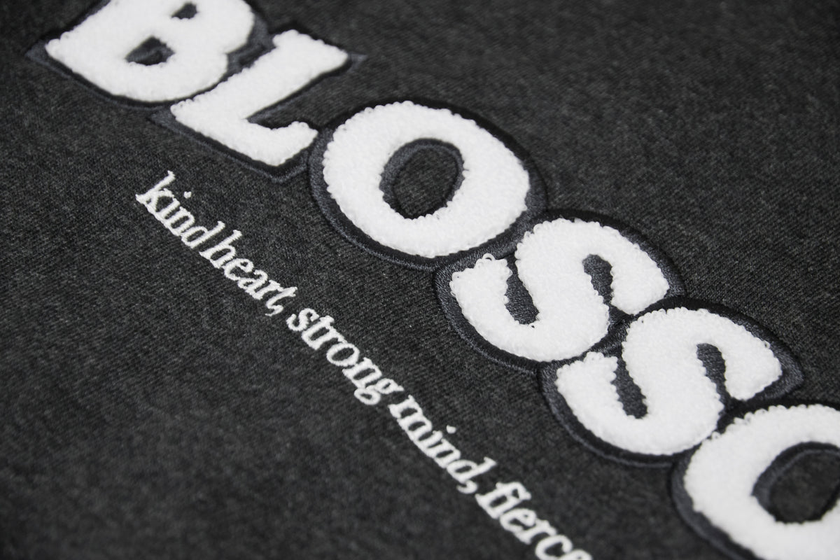Details close up of charcoal hoodie blossom
